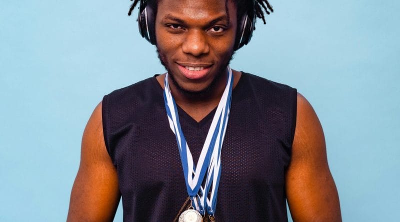 Professional esports team lifting a trophy in a packed arena