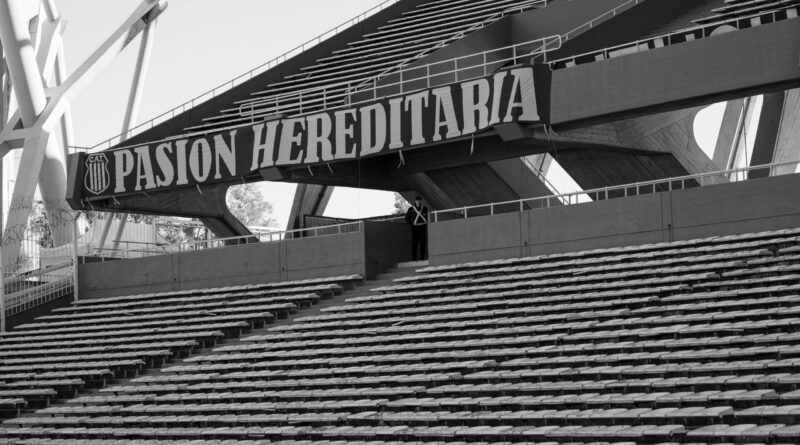 A dramatic view of a stadium reflecting modern Football Ownership Trends