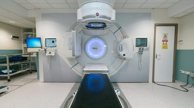 A conceptual illustration of advanced mRNA medical technology showing immune cells targeting cancer cells, representing the newly approved universal cancer vaccine.